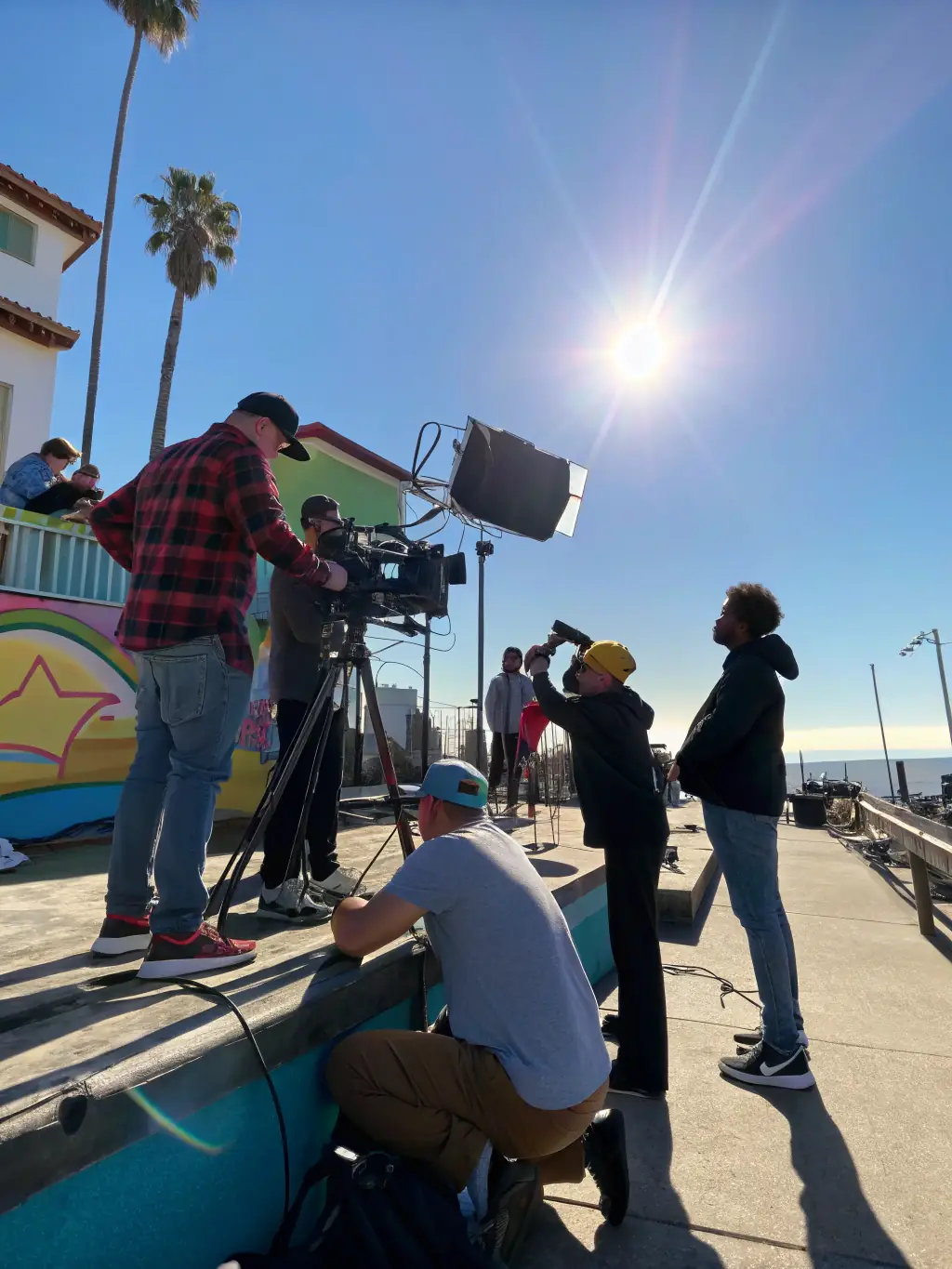 On-location filming with a professional crew capturing scenic shots for a long-form visual project, demonstrating the coordination of on-location filming.